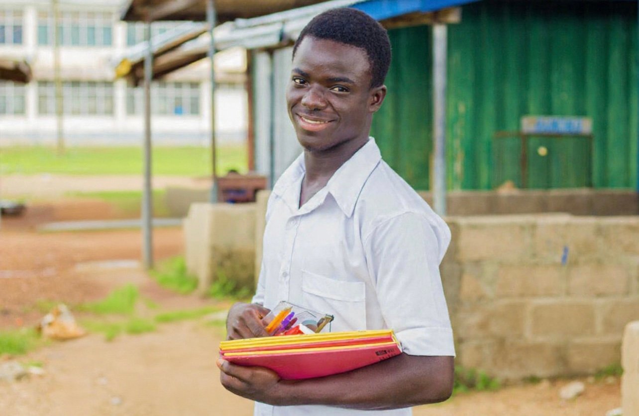 Isaac Receiving Educational Supplies to Support Learning
